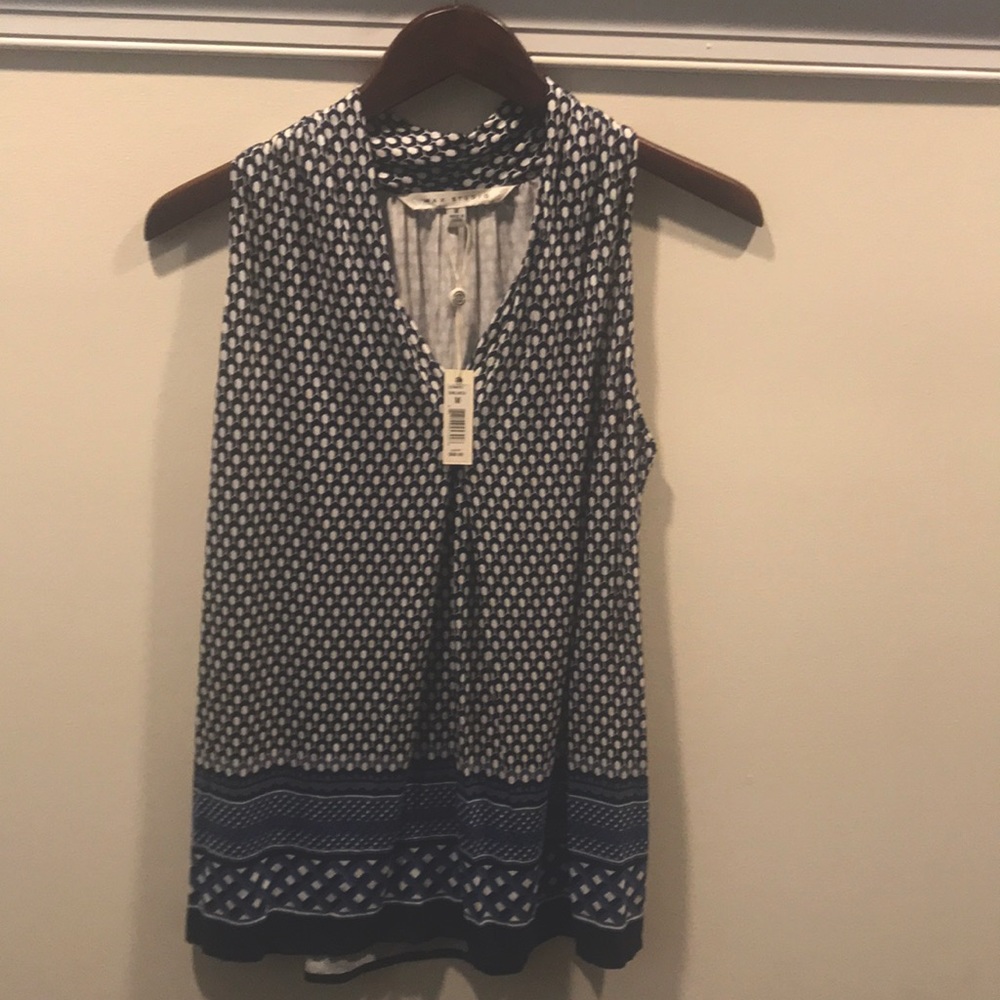 Medium top never worn with tags.
